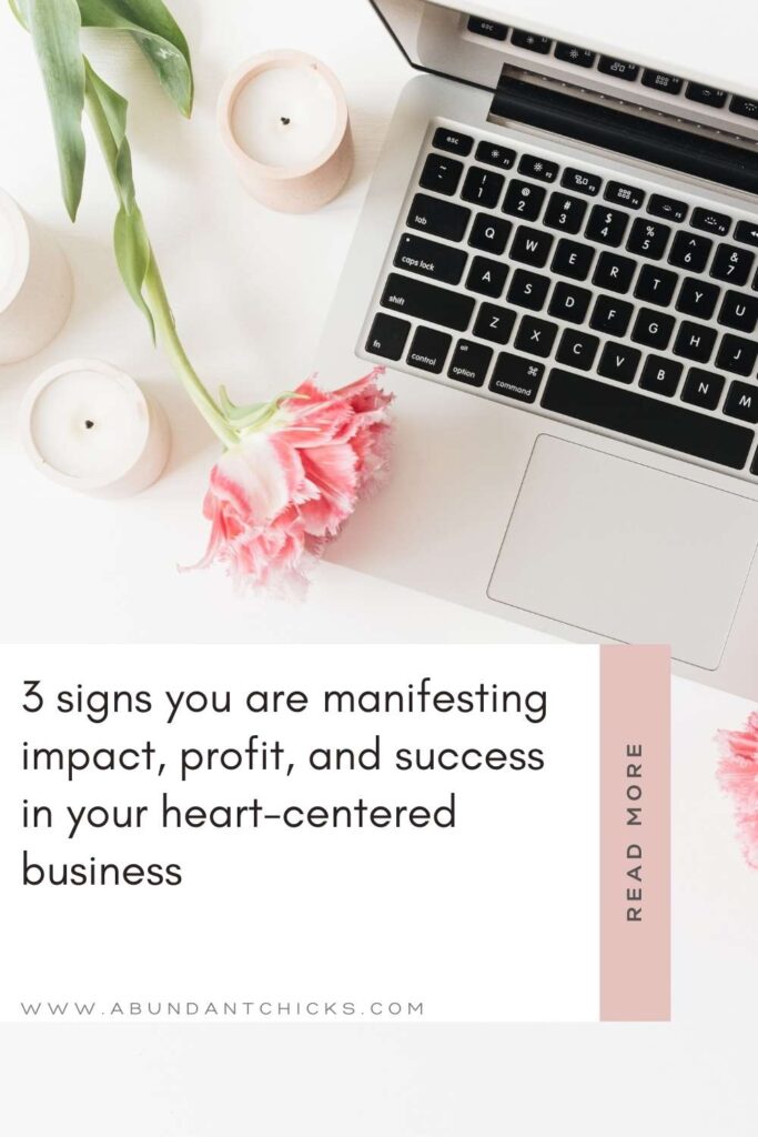 a grey macbook air pertaining to a heart-centered business owner at the top right corner, together with some pink roses to symbolise the manifesting journey towards more success and impact as a female entrepreneur
