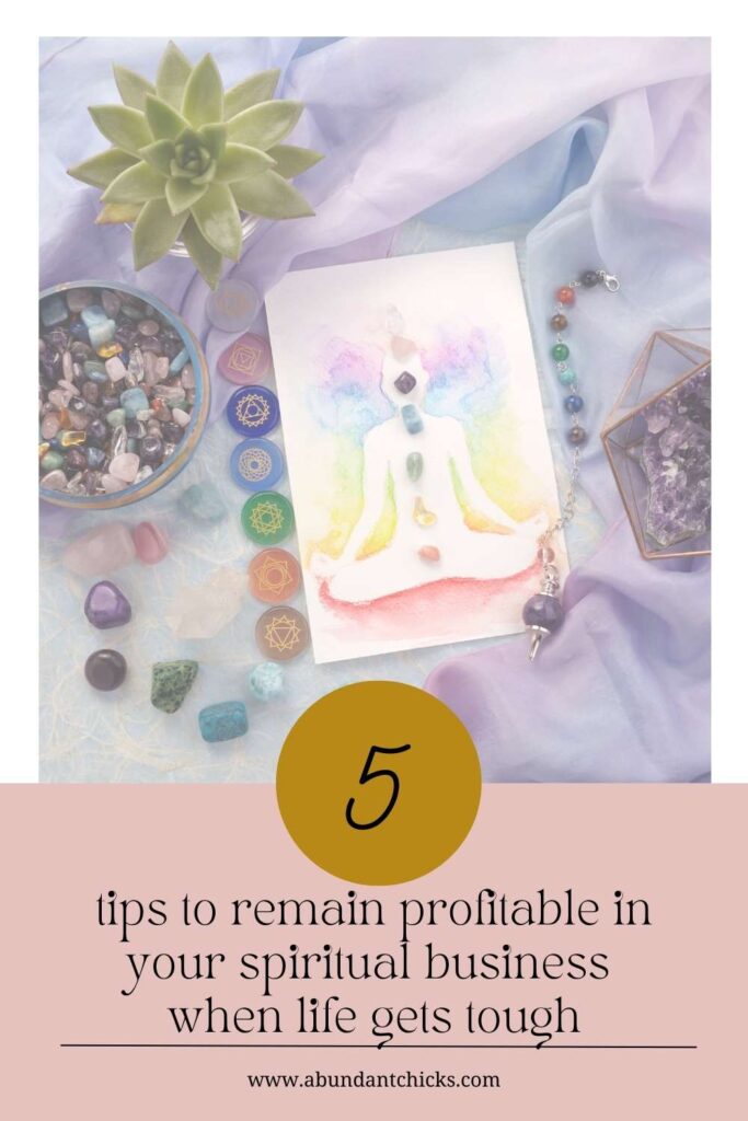 a spiritual business displaying a crystals, a pendulum and a card with the chakras